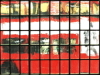London bus through church window image